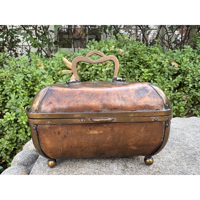 Antique English Edwardian Leather And Brass Box. This charming leather box is unusually shaped with a brass handle, trim...