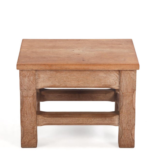 A striking example of mid-century French craftsmanship, this solid oak stool embodies the raw, sculptural appeal of the...