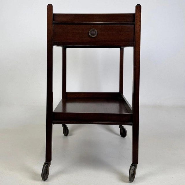 An elegant and beautifully crafted 19th-century Georgian style tea trolley, constructed in mahogany and distinguished by...