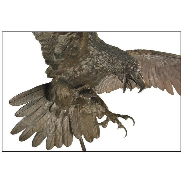 The eagle with its spread wings and splayed talons is of impressive craftsmanship and size, measuring approximately 38" x...