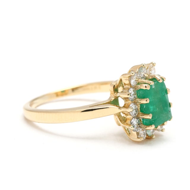 Stones: emerald, 1 emerald cut 7 x 5 mm approximately 1 total carat diamond, 12 round brilliant cut 2.2 mm approximately...