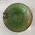 Handmade studio pottery bowl featuring a rich green glaze with natural speckling and an applied sculptural detail along...
