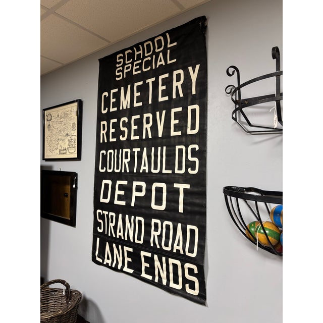 This vintage English textile art piece celebrates the iconic London double-decker bus, featuring bold typography and...