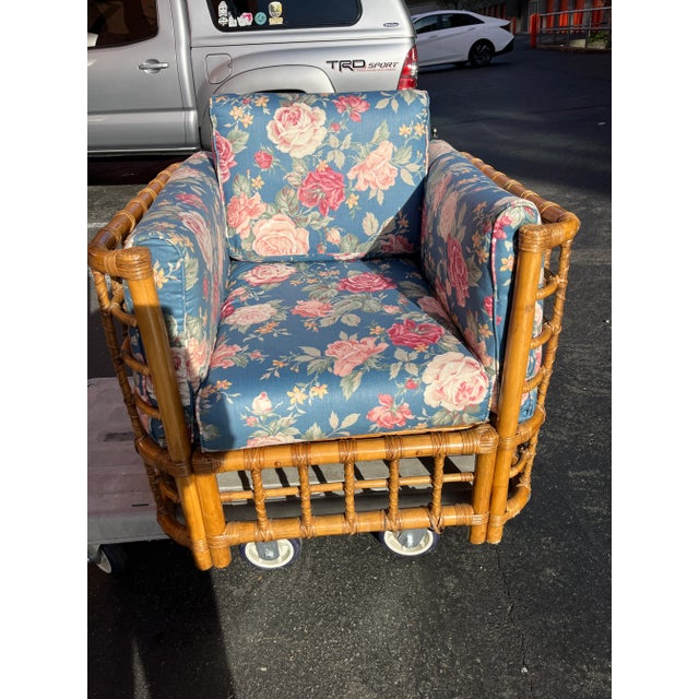 Handsome and tropically modern vintage rattan club chair, circa 1970s. Featuring a beautifully crafted handmade rattan...