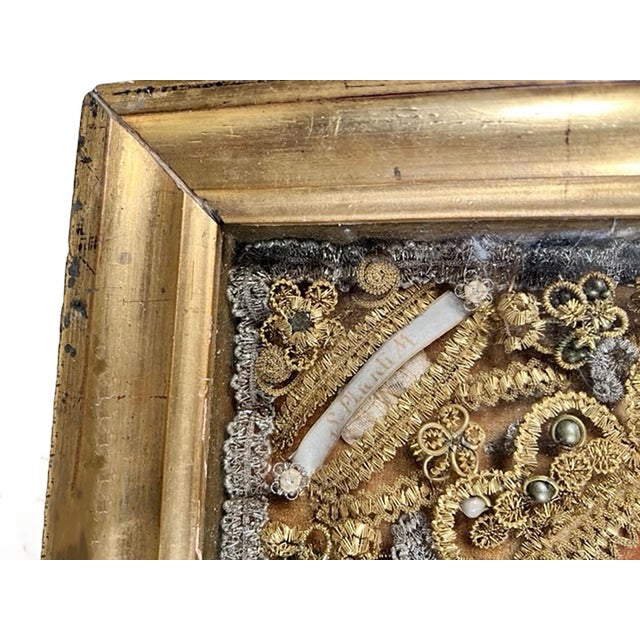 A magnificent 18th century Italian reliquary of a saint. The piece showcases intricate bright gold filigree work that...