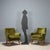 Pair of vintage armchairs with sprung padding, down cushions, original period green velvet upholstery, and wooden legs....