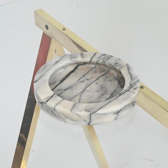 Marvelous large round ashtray carved from a single piece of precious Arabescato Carrara marble. This elegant and unique...