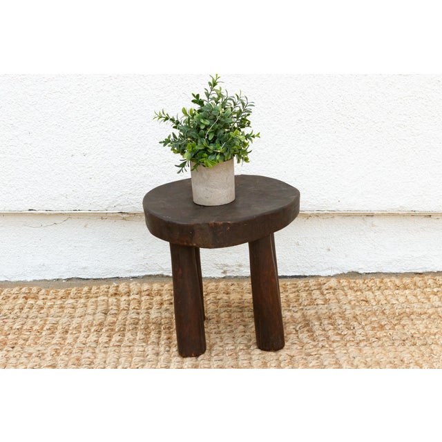 Add a touch of authentic African artistry to your home with this hand-carved milking stool. Handcrafted from a single log...