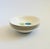 A set of 4 mid century ceramic small bowls by American Ironstone. Glossy white glaze with a pattern of blue flowers on...