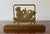 Charming vintage pineapple napkin holder featuring a sculptural brass pineapple mounted on a warm-toned wood base. The...