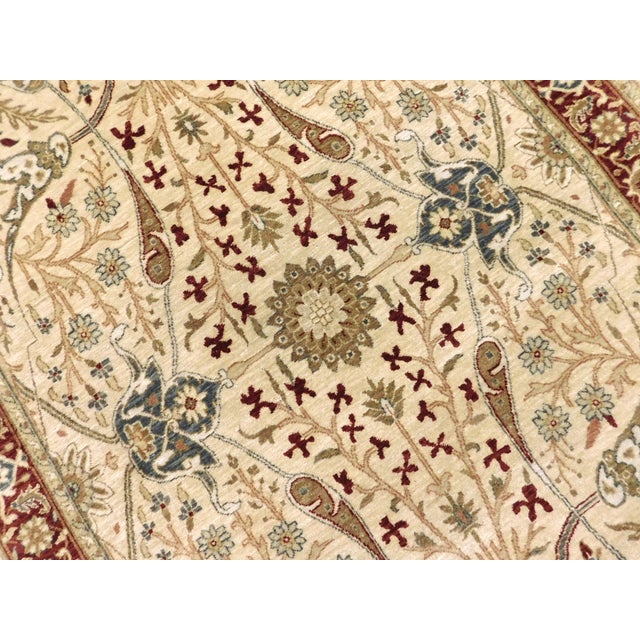 A hand knotted Agra design runner rug.