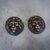 Handsome pair of vintage cast bronze lion head paperweights featuring highly detailed sculptural faces surrounded by full,...