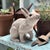 A hand-crafted studio pottery rabbit executed in terracotta with a glossy white glaze and applied amber glass eyes. The...