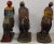 These figures depict the three wise men on horseback. Each figure has polychrome paint decoration on carved wood and glass...
