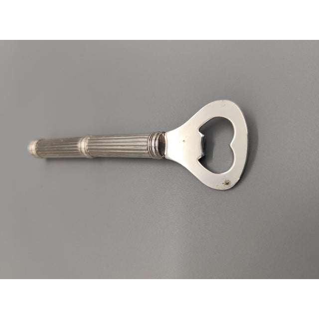 Art Deco Metal Bottle Opener Year: 1930s-1940s Material: Lightly silver-plated metal Style: Art Deco Dimensions: Length:...