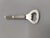 Art Deco Metal Bottle Opener Year: 1930s-1940s Material: Lightly silver-plated metal Style: Art Deco Dimensions: Length:...