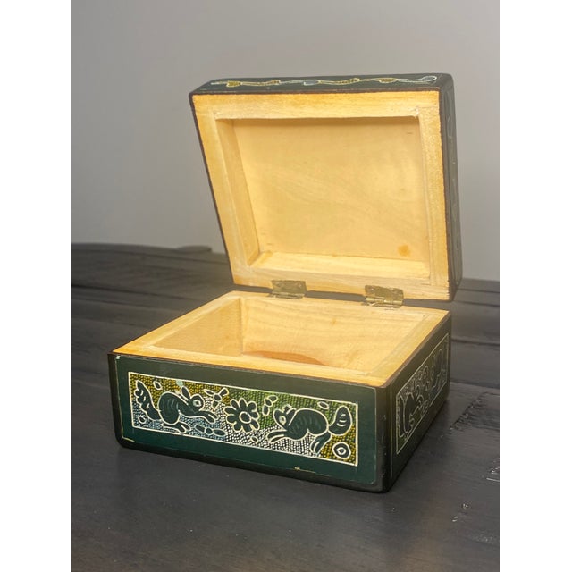A traditional hand-lacquered wooden box from Olinalá, Guerrero, Mexico, home to one of the country's most significant...
