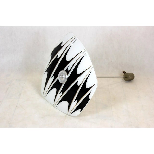 - Ceiling light dating from the 1950s or 1960s - Features a patterned glass shade - Made in former Czechoslovakia by...