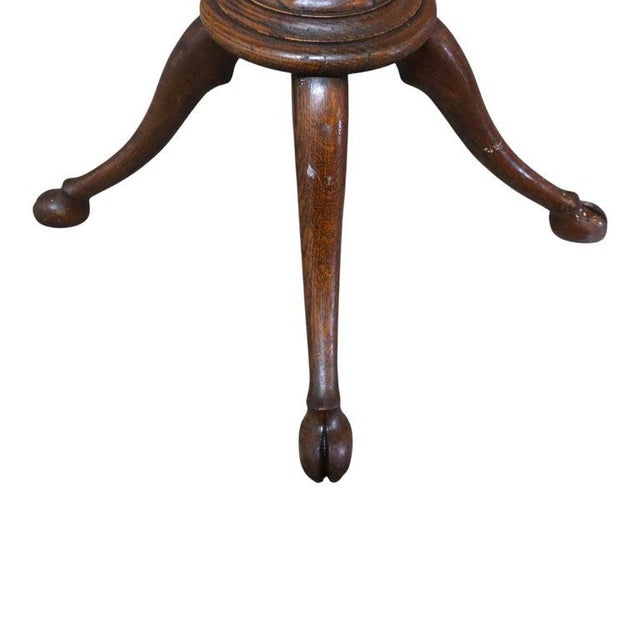An antique RJ Horner attr coat rack, crafted from oak and brass, dating to approximately 1920. This standing hall tree...