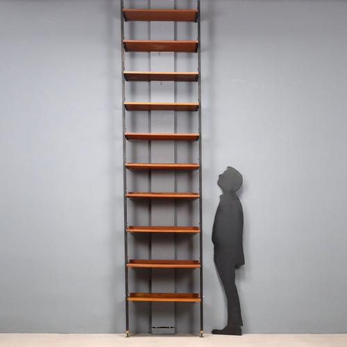 Ceiling-mounted bookcase with significant height (can be shortened upon request). The uprights are made of enameled metal...