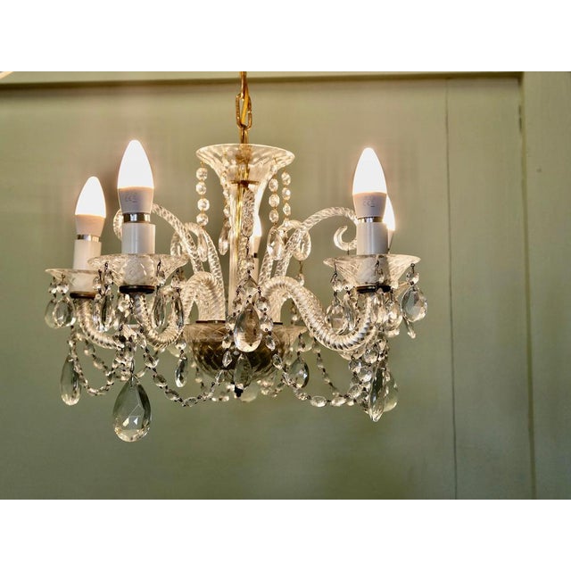 A Charming 5 Branch Venetian Style Chandelier This is a pretty quality piece, it has twisted arms in the venetian style...