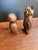 A cute pair of hand carved wooden owls. One with a baby owl at its feet, has glass eyes, made in Japan and the other...