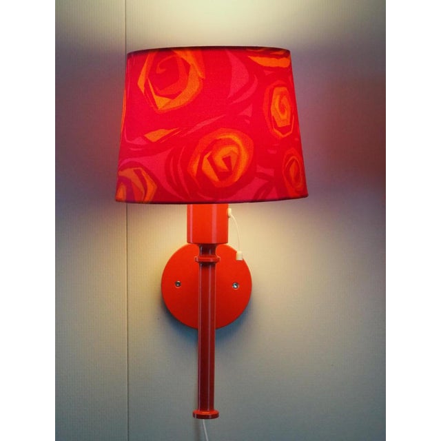 These are a pair of wonderful wall lamps in a lovely bright red color with the original shades included. It lights up with...