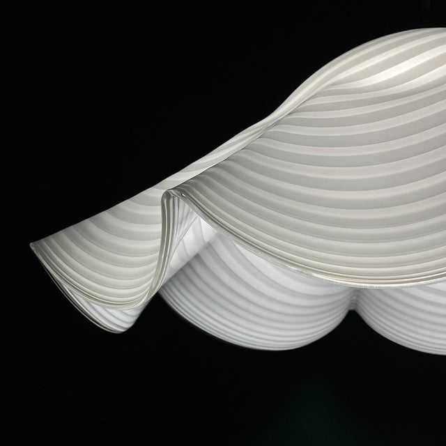 Vintage swirl white murano glass pendant lamp made in italy in the 1970s. the lamp is in excellent vintage condition....