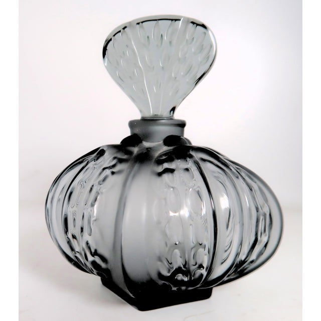 Lalique made the Mirabel perfume bottle in two colors, as well as clear. The most common color is Olive Green (sometimes...