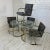 Four Brass Chairs Knoll Milo Baughman Style This set features 4 flat bar cantilevered brass arm chairs with an abstract...