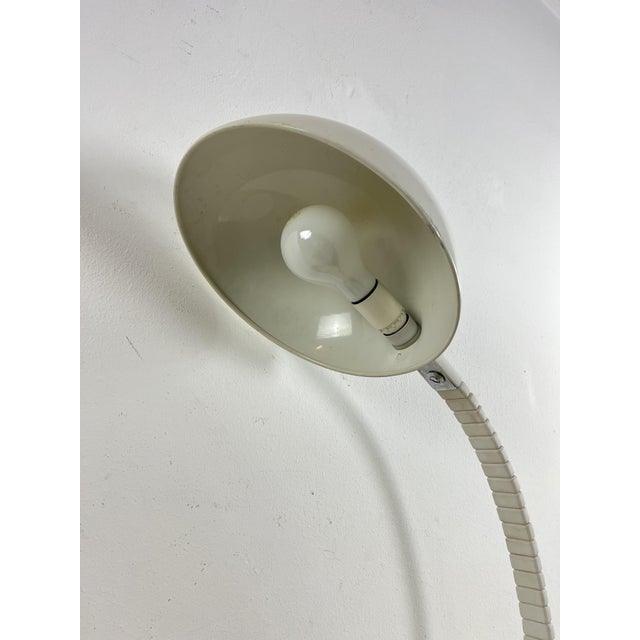 Model 660 table lamp designed by Elio Martinelli for Martinelli Luce, 1960s Aluminum, painted metal and plastic....