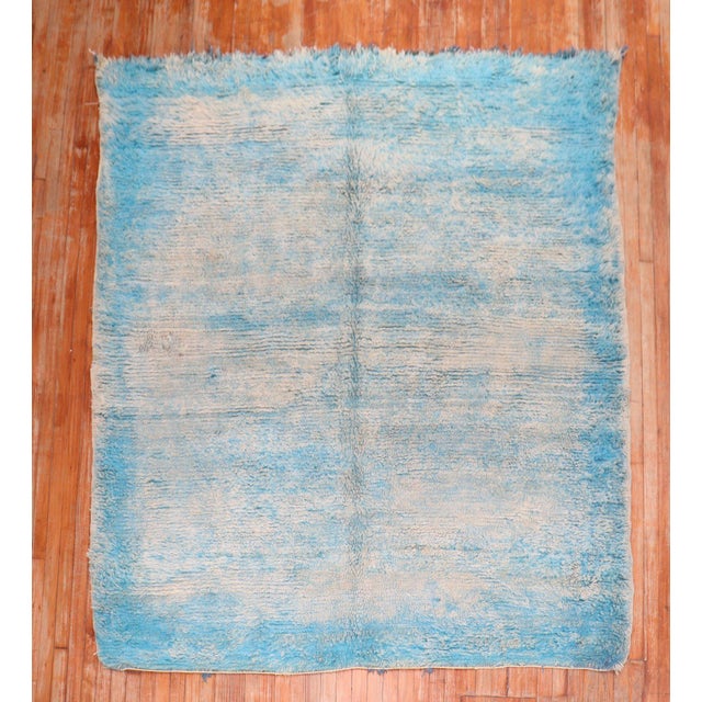 A square Size Vintage Moroccan rug in blotchy blues and ivory tones from the 3rd quarter of the 20th century Measures: 7'...