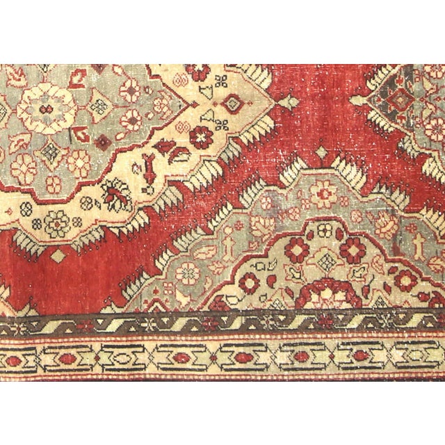 This authentic Turkish Oushak rug exemplifies the distinguished weaving heritage of Western Anatolia's renowned textile...