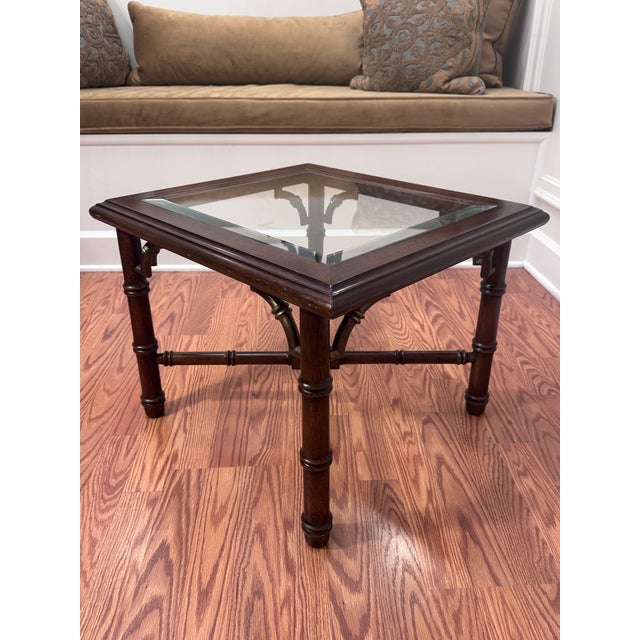 This vintage late 20th century side/accent table embodies a Hollywood Regency to Chinoiserie (Chinese Chippendale) styles....