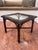 This vintage late 20th century side/accent table embodies a Hollywood Regency to Chinoiserie (Chinese Chippendale) styles....