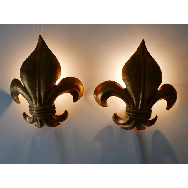 Lovely and highly decorative Mid-Century Modern gilt metal "Lily" sconces. Designed and manufactured by Hans Kögl, 1970s,...