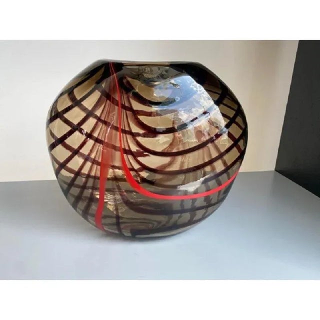 Impressive elegant Vase in fumè Murano Glass with red Reeds. The colored glass rods are melted into the fumè base ,hand-...
