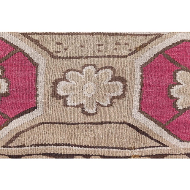 An exquisite example of late 19th-century Eastern European craftsmanship, this antique Bessarabian rug from Ukraine...