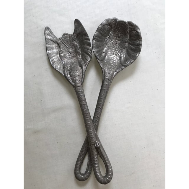 Set of salad servers by famous designer Arthur Court. Shaped as a pair of elephant heads with the trunks extended to serve...