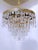 This is an Italian brass rim chandelier dressed with octagon chain and U-drop crystals drops. It has 3 Edison base...