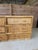 Beautiful vintage six-drawer dresser showcasing an exceptional blend of pencil reed, woven rattan, bamboo, and cane. The...