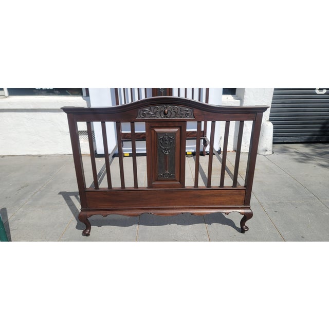 1900s Antique Victorian Hand Carved Walnut Color Bed. Complete with sturdy bed rails. Bed nobs and Broomsticks here we...