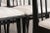A smart set of dining chairs from early to mid-20th century France, recently updated in ebonized (black painted) finish to...