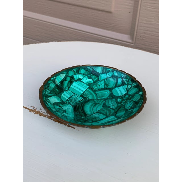 A stunning Russian style malachite bowl with brass trim Late 20th century Measures: 5"W x 5"D x 1.25"H. Very good vintage...
