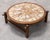 The charm of this 1960s coffee table lies in its magnificent ceramic top and solid wood frame. The botanical motifs are...