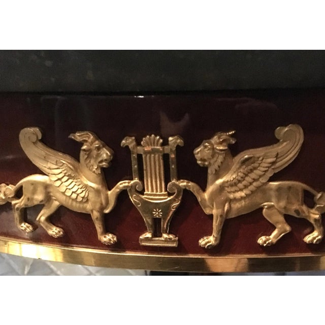 This French mahogany center table, designed in the style of Jacob Desmalter in the early nineteenth century, features...