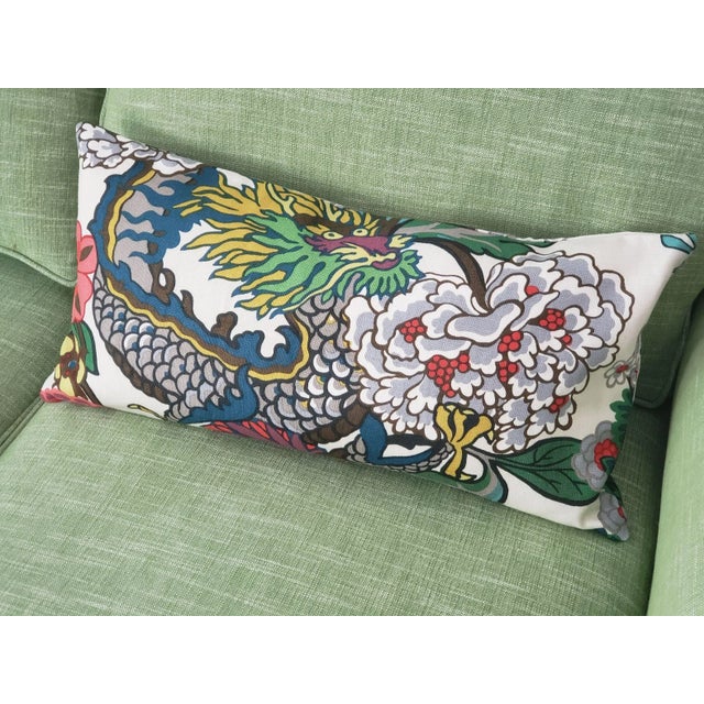 Schumacher's Chiang Mai Dragon fabric is featured on both sides of this 12" x 24" pillow, in the alabaster colorway. One...
