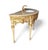 An exquisite Louis XVI–style carved vanity finished in pale cream with gilded accents and topped with a breathtaking...