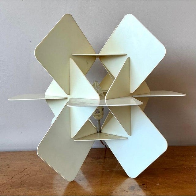 Illuminate your space with the sculptural brilliance of this vintage origami-style table lamp. A masterpiece of geometric...