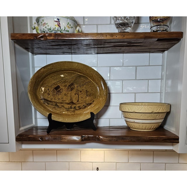 Stunning and highly unusual large platter with farm scene bearing cottage with porch, trees, farm animals, and even a...